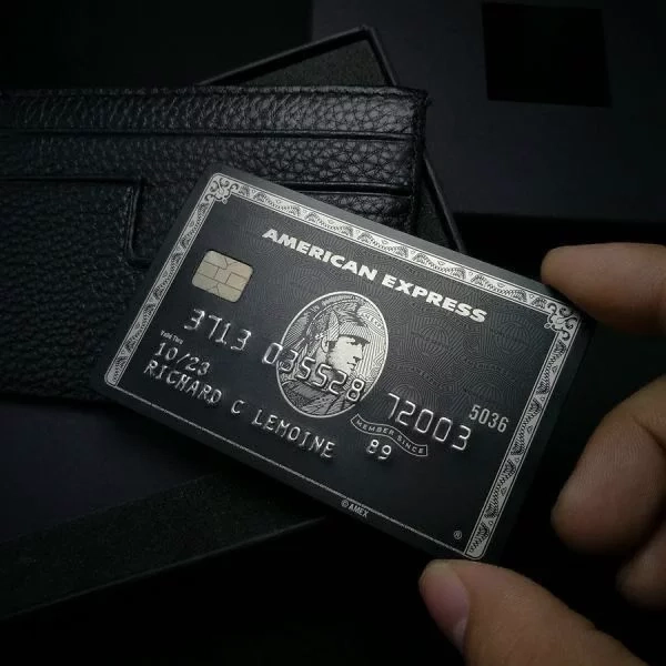 Recently completed custom metal credit card order with premium laser engraving and personalized design